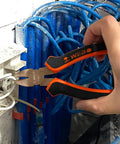 Close-up of hand using wire cutter from Non-Sparking Tools Set 37-Piece Pro Grade Spark Free Safety Kit on electrical wires.