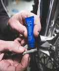 Applying Blue Medium Strength Threadlocker For Quick Vibration Control And Leakage Prevention Seals And Prevents Rust on bolt