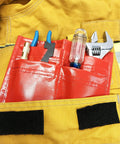 Red 4 Pocket Firefighter Tool Pouch for Police Belts and EMS Glove Pouch with tools, made from rubberized nylon, in turnout gear.