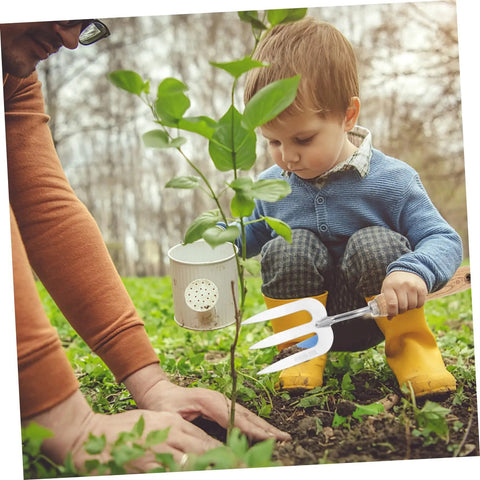 Child holding Multi Tool Garden Hand Shovel And Three Tooth Planting Fork With Built In Rake Handy Lightweight Hand Forged Digging