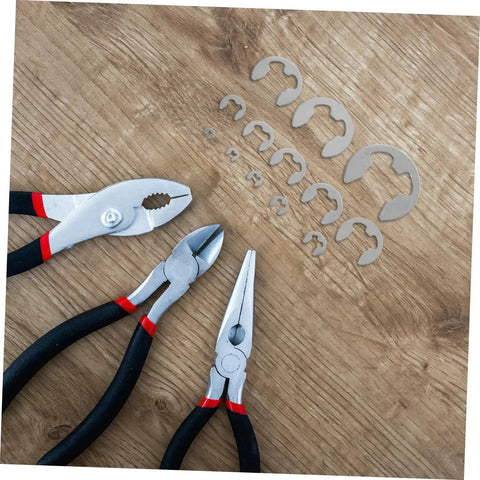 Stainless Steel External Circlip Assortment Kit E Type Retaining Rings for Shafts Gears and Bearings, tools on wooden surface