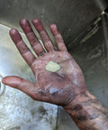 Dirty hand holding a dollop of Heavy Duty Mechanic Hand Cleaner With Pumice Lotion, Natural Citrus Scent, 7.5 Oz.