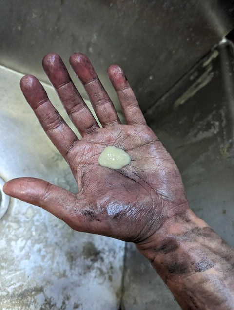 Dirty hand holding a dollop of Heavy Duty Mechanic Hand Cleaner With Pumice Lotion, Natural Citrus Scent, 7.5 Oz.
