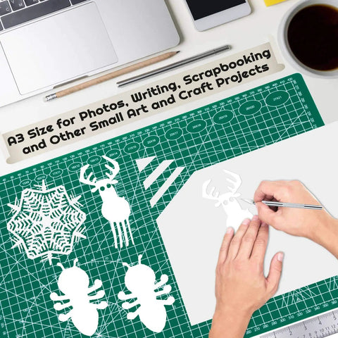 Self Healing Cutting Mat For Sewing And Crafts 12x18 Inch Double Sided 5-Ply Rotary Cutting Surface shown with paper crafts