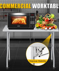 Foldable Stainless Steel Table 48x30 Inch Rock Solid Heavy Duty Portable Workstation For Kitchen Prep Catering Garage Workshop And Home Use 600 Pound Capacity Easy Fold And Clean with microwave and fruits on top in kitchen setting