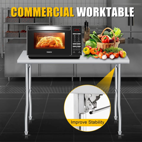 Foldable Stainless Steel Table 48x30 Inch Rock Solid Heavy Duty Portable Workstation For Kitchen Prep Catering Garage Workshop And Home Use 600 Pound Capacity Easy Fold And Clean with microwave and fruits on top in kitchen setting