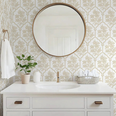 Beige Floral Peel And Stick Wallpaper With Delicate Arched Accents on bathroom wall with round mirror and plant.