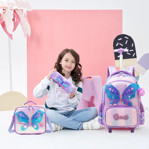 Young girl with children's butterfly rolling backpack set, including lunch bag and pencil case, in a colorful design perfect for school.