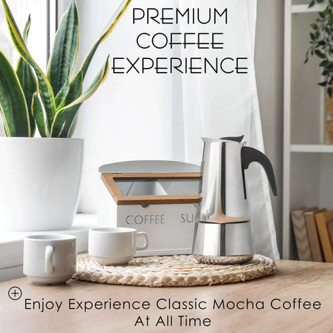 Stovetop Espresso Maker 9 Cup Moka Pot In Stainless Steel 450ml 15oz on a wooden table near two mugs