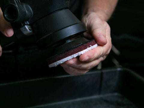 Close-up of a DA 3 Inch Microfiber Cutting Disc being attached to a polisher, part of the 12 Pack For Car Detailing Pro Grade Scratch Removal Cuts Through Scratches Without Swirls Works With D300 Fiber Correction Compound No Sling Low Dust Easy Cleanup.