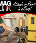 MagLink 4-inch magnetic dust-collection hose being attached to a yellow dust collector, side view.