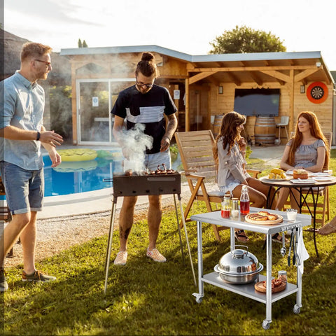 Go-To 36X24 Inch NSF Stainless Steel Work Table On Wheels With Hooks And A 3 Stage Adjustable Shelf Heavy Duty Prep Station in outdoor setting