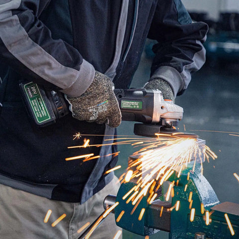 Person wearing Level 5 Cut Resistant Work Gloves For Gardening And Tough Jobs, using an angle grinder, sparks flying.