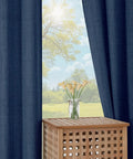 Navy Blue Curtain Set With Light Filtering Faux Linen Texture Two Panels 52W By 90L Rod Pocket Drapes framing a sunny window