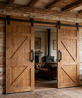 Rustic living room with dual sliding wooden doors showcasing heavy-duty black gate pull handles.