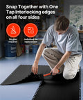 Man installing Interlocking Garage Floor Tiles 12 Inch Square 25 Pack Graphite Grey Non Slip Diamond Plate Covering in garage