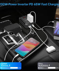 Roadtrip Ready Car Power Inverter Converts Dc 12V To Ac 110V With 200 Watt Output, charging devices in car console.