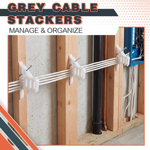 200 Piece Cable Management Kit With Steel Nails And White Wire Clips. Grey cable stackers holding wires on wooden wall.