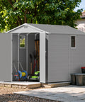 6x10 Ft Plastic Storage Shed with Floor Lockable Door and Windows Waterproof Outdoor Garden Tool Shed in a backyard setting