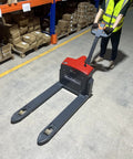 MechMaxx 3300lb Lithium Electric Pallet Jack in use, focusing on ergonomic design, 45x27 inch forks in a warehouse setting.