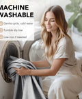 Woman placing faux linen look 100% blackout curtain panels into a washing machine, demonstrating machine washability.