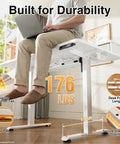 Solid Build Electric Standing Desk With 55x26 Inch Adjustable Height And Clean White Finish displaying a user typing, showcasing durability.