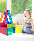 Child playing with Supersized Magnetic Building Tiles 12pc Base Plate Set for Kids STEM Construction Toy Jumbo XL on floor indoors.