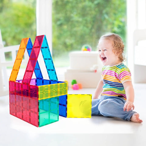 Child playing with Supersized Magnetic Building Tiles 12pc Base Plate Set for Kids STEM Construction Toy Jumbo XL on floor indoors.
