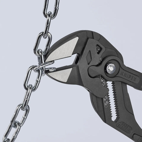Three Piece Black Pliers Wrench Set Built For Quick Grips And Turning, gripping metal chain with high leverage and heavy duty build.