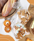 Clear Cellophane Treat Bags 200 Pack 6X10 Inch With Gold Twist Ties For Cookies Candy Birthday Party Favors Graduation And Homemade Bakery Packaging Must Have Bulk Value Pack Food Grade Small Candy Bags filled with candy and cookies.