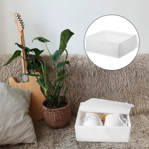 Premium Collapsible Oxford Cloth Drawer Organizer With Lid For Underwear Bras And Bathing Suits on a cozy sofa.