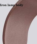 Close-up of iron lamp body from Modern Led Wall Sconce Featuring Smooth Iron Body And Soft Acrylic Diffuser.