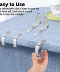 24 Pack Stainless Steel Tablecloth Clips for Outdoor Tables and Picnics, shown securing a blue fabric tablecloth, rustproof design