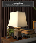 Tall Porcelain Lantern Table Lamp With Black And Brown Ming Medallion Design, White Pagoda Shade, on nightstand with books