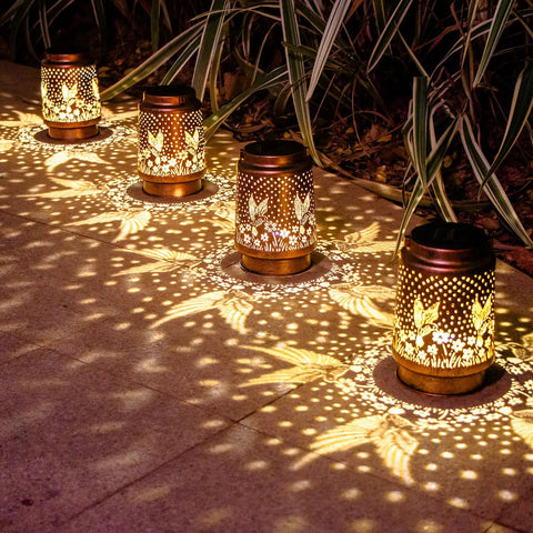 Outdoor Solar Lantern With Hummingbird Pattern illuminating pathway, waterproof metal garden light for yard decor, cozy evening vibe
