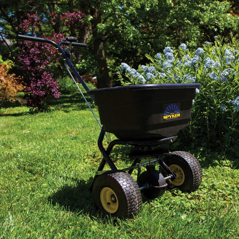 Spyker Pro Series 50 Pound Broadcast Spreader with 5 Pound Handheld Spreader Kit for Lawn Care on grass