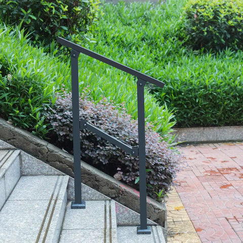 Built Like A Brick Carbon Steel Handrail For Outdoor Steps Rust Free Wrought Iron Style Stair Railing with heavy duty brackets installed on steps.