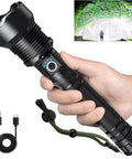 Person holding Beast Bright 99000 Lumens LED Flashlight Rechargeable With USB Cable Five Modes Waterproof Power Torch.