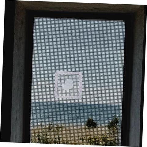 Self Adhesive Window Screen Repair Patch Kit For Quick Coverage And Strong Adhesion No Fuss Easy Stick On Patches For Door And Window Screens Fix Holes And Cracks With White Finish installed on a window screen