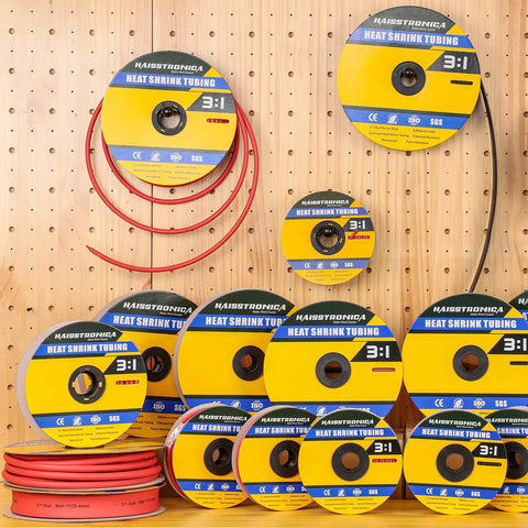 Spools of 3 To 1 Heat Shrink Tubing With Adhesive Lined Marine Grade Black 65 Ft Roll, one quarter inch diameter on a pegboard display.