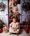 Slick White Barn Door Photography Backdrop For Studio Sessions And Indoor Portraits Seamless Microfiber Photo Background Wall Cover With Light Blocking Build And Zero Sweat Setup For Clean Shots featuring a baby and decorated holiday scene.