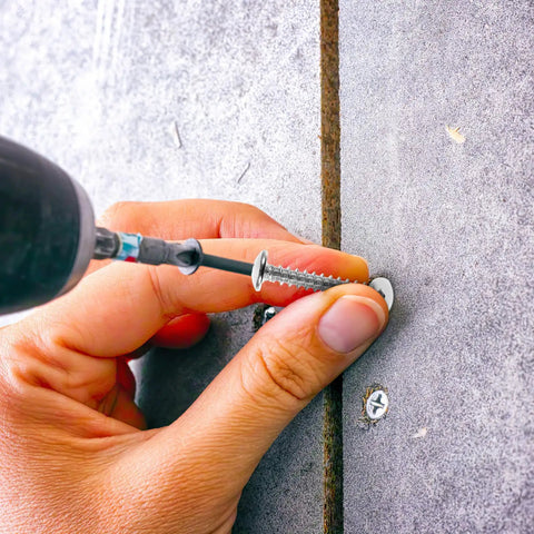 Self Drilling Drywall Anchors and Screws Kit, Heavy Duty Plastic Nylon Anchors with Large Threads being installed in drywall