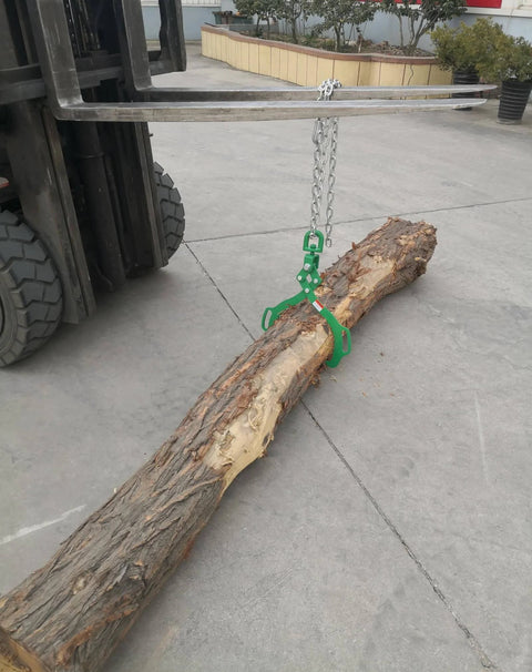 Log Lifting Tongs With Two Serrated Swivel Claws 32 Inch Opening Heavy Duty Timber Grapple attached to forklift lifting a log
