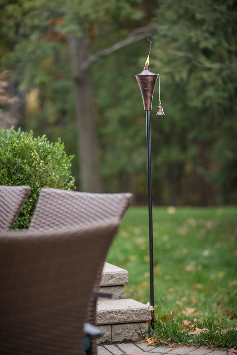Oahu Tiki Style Outdoor Torch 53 Inch with Snuffer in Brushed Bronze on Lawn