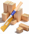 Heavy Duty Japanese Pull Saw For Fine Woodworking 6 Inch Dovetail Blade With 23 TPI SK5 Steel next to wooden blocks.