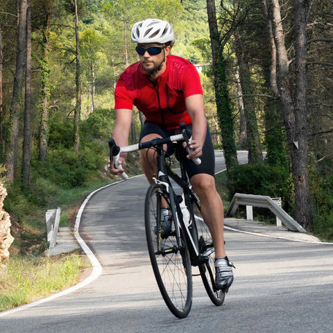 Cyclist on a road using Heavy Duty 700C Bike Inner Tubes 44C To 50C AV48 Schrader Valve 2 Pack For 700x44C tires.