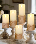 Flickering Flameless Candles Set Of 5 Battery Pillar Candles With Timer, hemp rope wrapped wax lights on table.