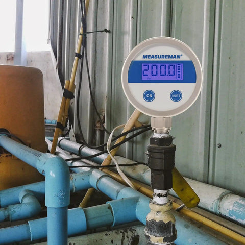 Budget Friendly Digital Pressure Gauge With 2.5 Inch Blue Backlit LCD 0 To 200 PSI All Stainless Steel Case One Quarter Inch NPT Connection One Percent Accuracy For Precise Readouts In Harsh Environments mounted in industrial setting