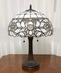 Vintage Tiffany Style Stained Glass Table Lamp 22 Inch Tall With White And Gray Mahogany Floral Shade On Wooden Table