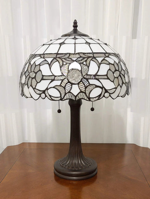 Vintage Tiffany Style Stained Glass Table Lamp 22 Inch Tall With White And Gray Mahogany Floral Shade On Wooden Table